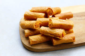Rolled crispy wafers filled with shredded pork floss, Thai snack.