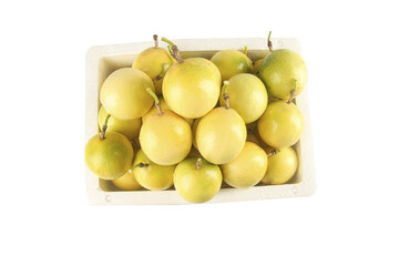 Fresh Golden Passion Fruit from Hainan in White Display Container on White Background