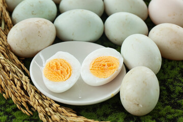 Fresh Free-Range Duck Eggs with Golden Yolks on Natural Green Background