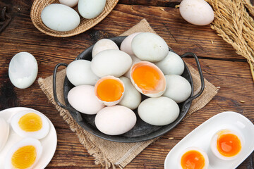 Fresh Duck Eggs in Rustic Cast Iron Pan on Wooden Farmhouse Table with Bright Orange Yolks