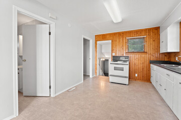 Kitchen with a stove and oven, and a sink