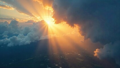 Fototapeta premium Golden sunbeams piercing through gaps in dense clouds, illuminating a landscape below with vibrant light A breathtaking display of nature's beauty , sunlight, crepuscular rays, nature