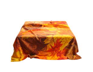 Autumn leaves pattern draped over a square table isolated on transparent background
