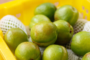 Fresh Green Pears in Yellow Colander - Healthy Organic Fruit with Big Flavor