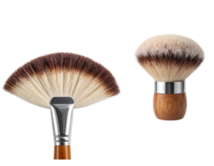 Two makeup brushes one fan shaped and one round with wooden handles isolated on transparent background
