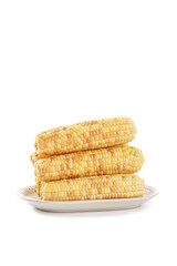 Fresh Sweet Corn Cobs Stacked on White Plate Isolated on White Background