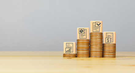 Business strategy icons on wooden cubes with money coins to stack