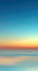Blurry sunset over a tranquil ocean