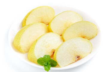 Fresh Sliced Dangshan Pears from Anhui China on White Plate with Mint Garnish