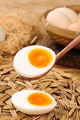 Fresh Hard-Boiled Eggs with Golden Yolks on Wooden Spoon in Rustic Farmhouse Kitchen