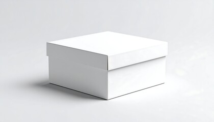 Fototapeta premium A plain, square, white cardboard box with a lid. It sits on a neutral background