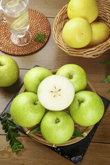 Fresh Green Asian Pears in Wicker Basket on Wooden Table with Water Glass and Natural Lighting