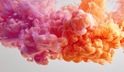 Abstract swirls of pink and orange ink in water