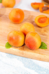 Fresh Apricots on Wooden Board with Mint Leaves - Healthy Summer Fruit