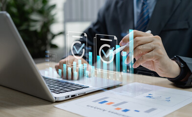 Businessman reviewing business growth chart for project approval, representing corporate decision-making, financial investment, and real estate investment strategies in modern business management.