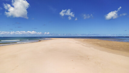 Calm blue tides bring serenity to Castelhanos Beach, a hidden gem on Boipeba Island, Brazil.