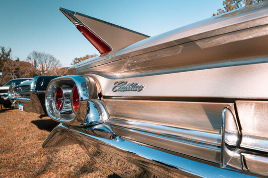 Classic taillight of a 1961 Cadillac showcased at the monthly classic car gathering in Londrina, Brazil.