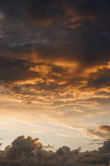 Dramatic sunrise sundown sky background with colorful clouds without birds. Panoramic sky background