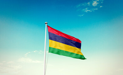 Mauritius national flag waving in beautiful sky with mast. A proud moment flag waving with sunlight.