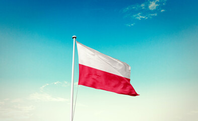 Poland national flag waving in beautiful sky with mast. A proud moment flag waving with sunlight.