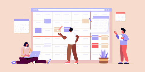 Diverse team collaborating on a large digital calendar planning tasks and projects together