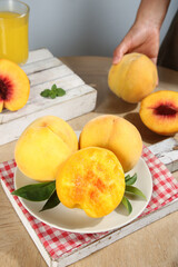 Fresh Yellow Peaches with Juice on Kitchen Table - Healthy Summer Fruit Breakfast
