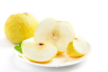 Fresh Asian Pear Slices on White Plate with Mint Leaf Garnish