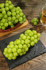 Fresh Green Grapes on Slate Board with Wine Glass - Healthy Fruit Still Life
