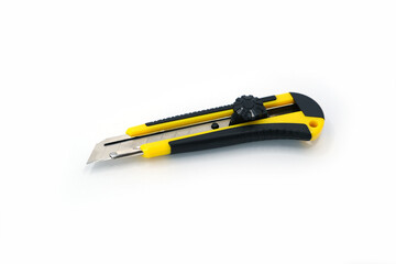 Yellow and black utility cutter knife with retractable blade, photographed on a clean white background