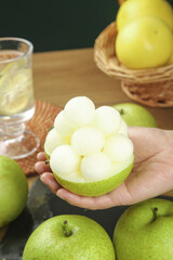 Fresh Asian Pear Cut in Decorative Flower Shape - Healthy Fruit Preparation and Food Art Display