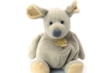 Soft plush toy in the shape of a gray mouse, photographed on a clean white background