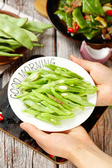 Fresh Green Snap Peas Good Morning Healthy Breakfast Vegetable Dish on Rustic Wooden Table