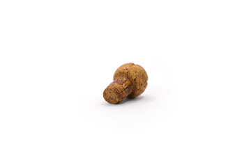 Natural cork stopper made from cork oak wood, photographed on a clean white studio background