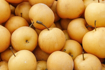 Fresh Golden Asian Pears Stacked Display Market Scene