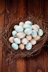 Fresh Farm Raised Chicken Eggs in Natural Nest on Rustic Wood Background