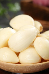Fresh Shandong Garlic Cloves Peeled and Ready for Cooking in Wooden Bowl