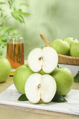 Fresh Green Apples and Pear Juice Healthy Organic Fruit Display on White Marble Surface