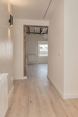 Unfurnished master bedroom where centuries-old dark wood beams are the absolute visual protagonist