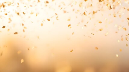 Golden confetti falling gracefully against a warm abstract background, evoking celebration.