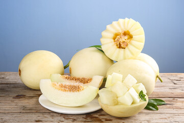 Fresh Honeydew and Cantaloupe Melon Slices on Rustic Wooden Table