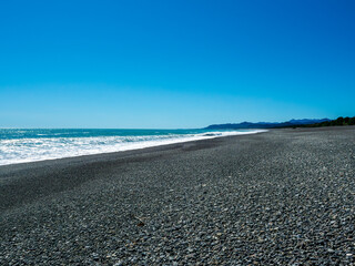 Shichiri Mihama Coast is Japan's longest beach. The endless expanse of black pebbles, polished by the rough waves of the Kumano-nada Sea, creates a powerful contrast with the magnificent ocean. 