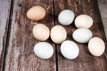 Fresh Country Farm Eggs on Rustic Wood - Free Range Chicken Eggs in Natural Colors