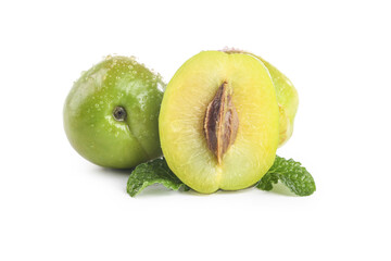 Fresh Green Plum Fruit Cut in Half with Water Drops and Mint Leaves on White Background