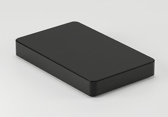 Sleek black box sits on a plain white surface, showcasing minimalist aesthetic and clean lines in a studio setting, creating a modern and elegant mood.
