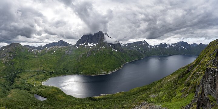 View of Mefjorden fjord from Barden mountain, Breidtind mountain peak behind, Senja, Norway