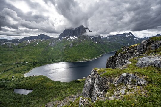 View of Mefjorden fjord from Barden mountain, Breidtind mountain peak behind, Senja, Norway