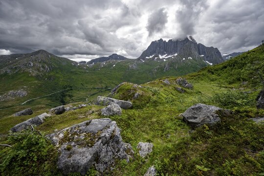 View of mountain landscape, hike to the summit of Barden, behind mountain peak Breidtind, Senja, Norway