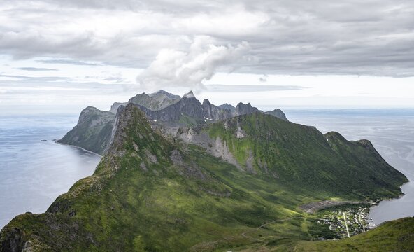 View of mountain peaks on the headland of Fjordg&aring;rd with peak Segla, fjords &Oslash;yfjorden and Mefjorden, view from Barden mountain, Senja, Norway