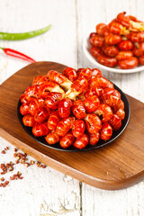 Fresh Qianjiang Style Crawfish Lobster Tails in Spicy Red Sauce on Wooden Board