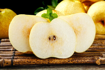 Fresh White Pear Slices with Mint on Bamboo Mat - Healthy Fruit Food Photography